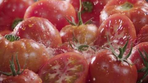 Tomato falling in juice with splash between tomatoes. Slow motion Stock Footage 90233940