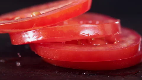 Tomato Falling in Super Slow Motion (1000fps) - Mesmerizing Fruit Impact Watch a Stock Footage 253297983