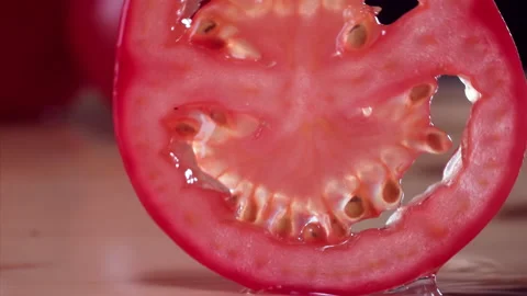 Tomato Falling in Super Slow Motion (1000fps) - Mesmerizing Fruit Impact Watch a Stock Footage 253299550