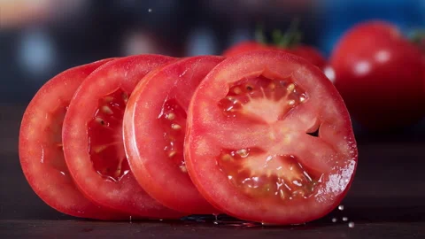 Tomato Falling in Super Slow Motion (1000fps) - Mesmerizing Fruit Impact Watch a Stock Footage 253299955