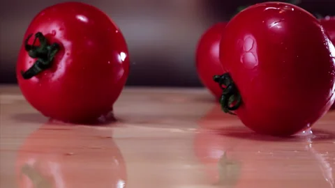Tomato Falling in Super Slow Motion (1000fps) - Mesmerizing Fruit Impact Watch a Stock Footage 253301483