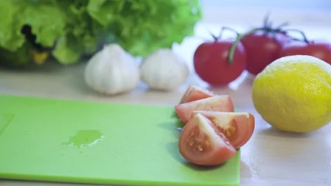 Tomato falls on the table, slow motion Stock Footage 74467314