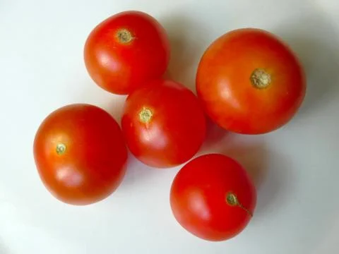 Tomato Five On Plate Stock Photos
