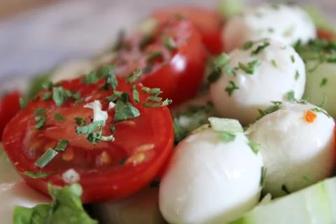 Tomato in the foreground. Stock Photos