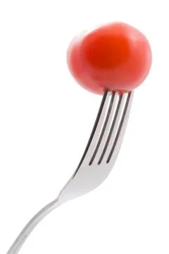Tomato on fork isolated Stock Photos