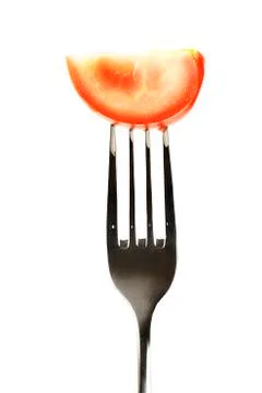Tomato on a fork Stock Photos