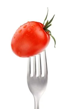 Tomato on fork Stock Photos