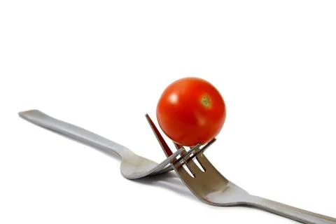 Tomato with fork Stock Photos