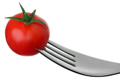 Tomato on a fork on white Stock Photos