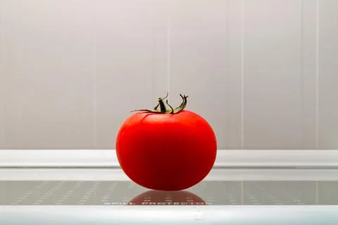 Tomato in the fridge Stock Photos