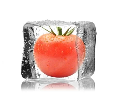 Tomato in ice cube Stock Photos