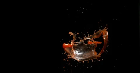 Tomato Juice Exploding and Splashing on Black Background, Slow Motion 4K Stock Footage 120040957