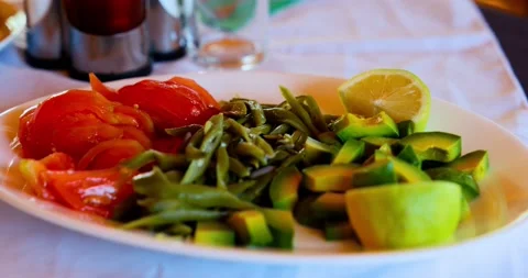 Tomato, lettuce Salad in a table 스톡 동영상 140273995