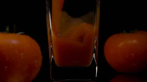 For tomato lovers. Super slow motion shot of pouring tomato juice into a Stock-Footage 147412841