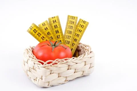 Tomato with a measuring tape Stock Photos