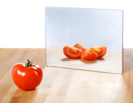 Tomato in mirror image,abstract vision Stock Photos