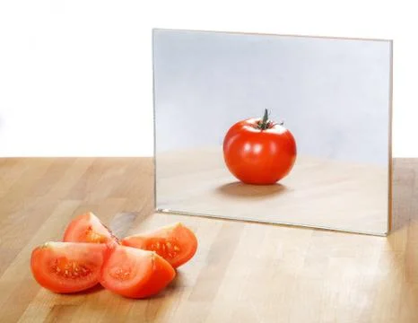Tomato in mirror image,abstract vision Stock Photos