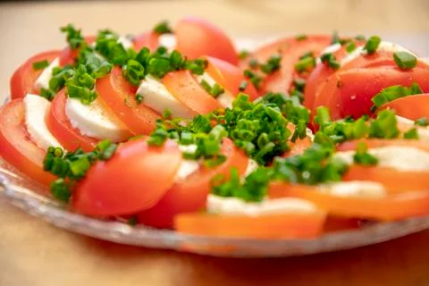 Tomato Mozzarella with chives Stock Photos