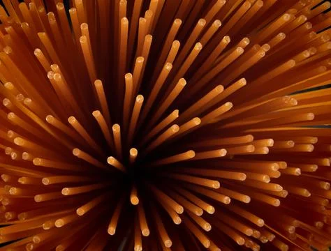 Tomato pasta makes a beautiful pattern. Background from red spaghetti. Stock Photos