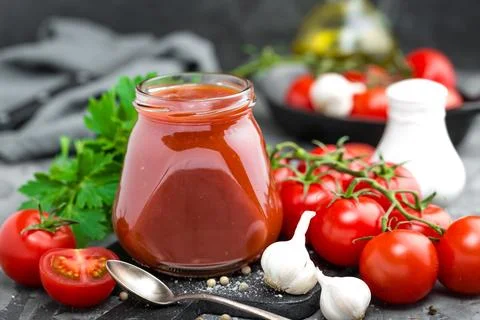 Tomato paste and fresh tomatoes, tomatos puree Stock Photos