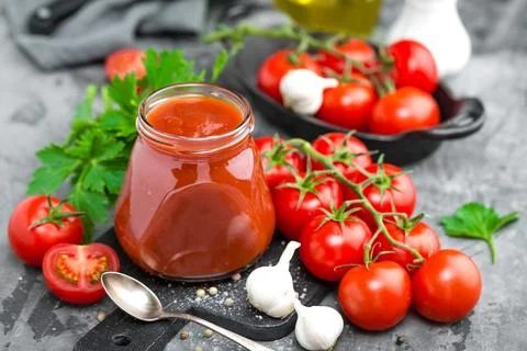 Tomato paste and fresh tomatoes, tomatos puree Stock Photos