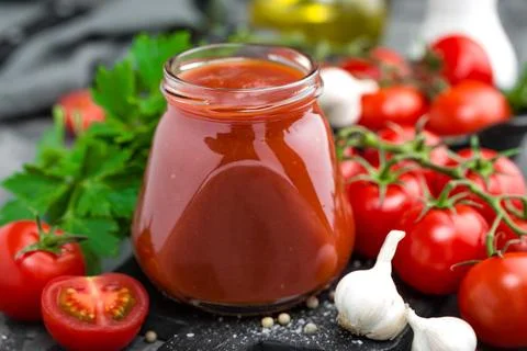Tomato paste and fresh tomatoes, tomatos puree Stock Photos