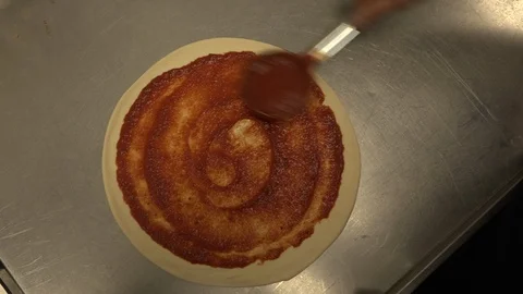 Tomato paste on a pizza tortilla. Video stock 126912813