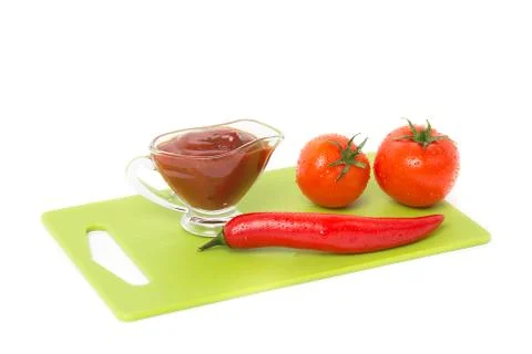 Tomato with pepper on white background Stock Photos