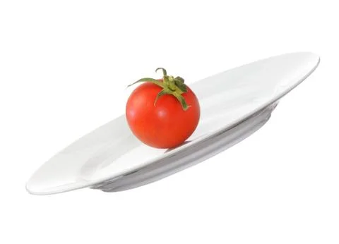 Tomato on plate Stock Photos