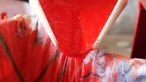 Tomato pulp flowing- homemade production of tomato sauce-tomato pulp flows Stock Footage 83396541