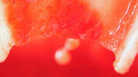 Tomato pulp flowing- macro- slow motion Stock Footage 85596967