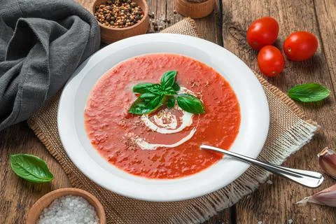 Tomato puree with basil close-up. Vegetable, healthy soup. Stock Photos