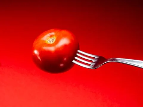 Tomato with red background Stock Photos