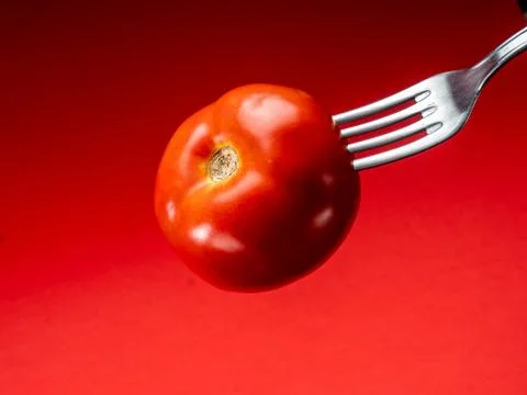 Tomato with red background Stock Photos