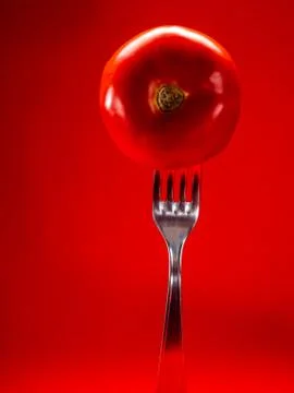 Tomato with red background Stock Photos