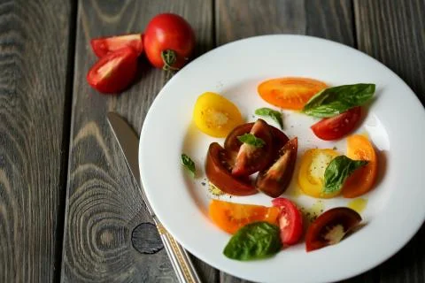 Tomato salad with basil Stock Photos
