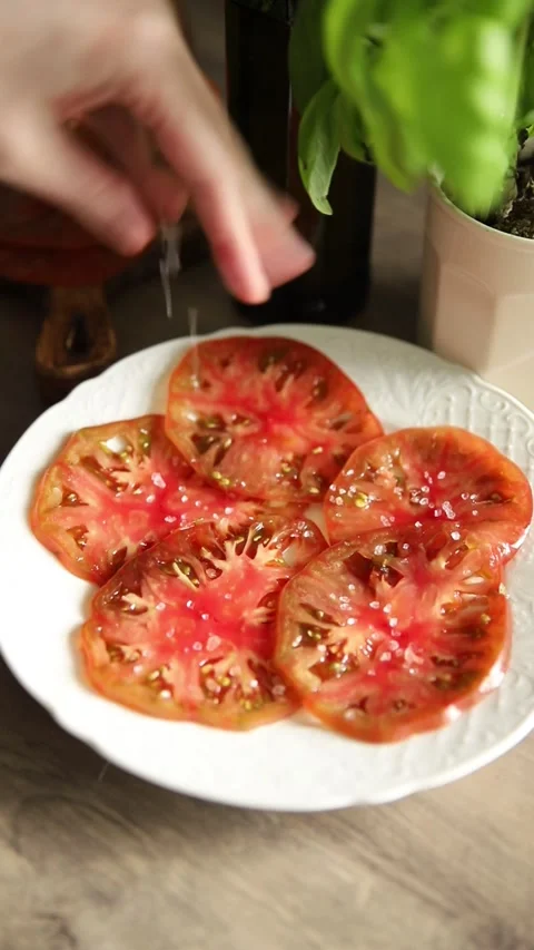 Tomato salad sliced vegetables, olive oil carpaccio food preparation tasty Stock Footage 339697432