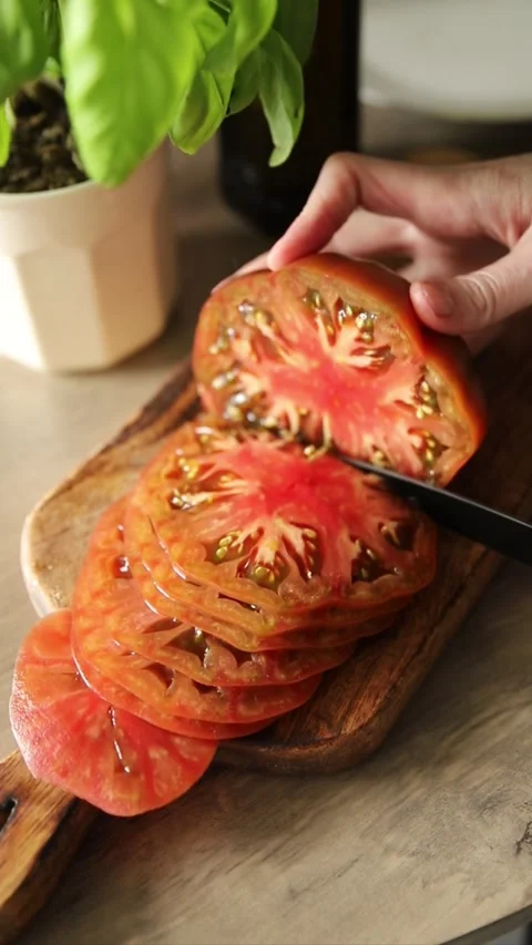 Tomato salad sliced vegetables, olive oil carpaccio food preparation tasty Stock Footage 339697433