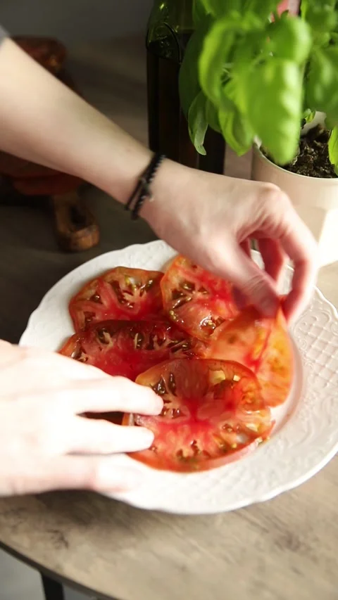 Tomato salad sliced vegetables, olive oil carpaccio food preparation tasty Stock Footage 339697441