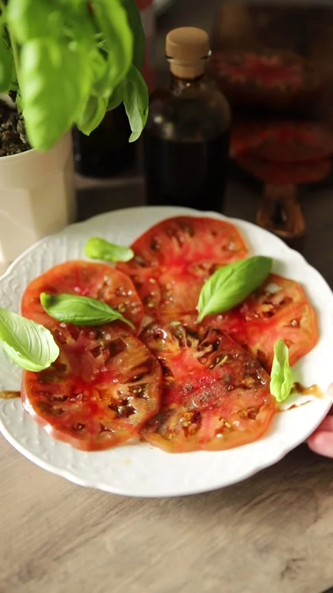 Tomato salad sliced vegetables, olive oil carpaccio food preparation tasty Stock Footage 339697452