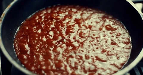Tomato sauce boiling in the pan Stock Footage 84769393