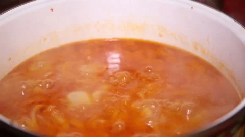 Tomato sauce. Boiling tomato sauce made from chopped fresh ripe tomatoes. Stock Footage 138752695