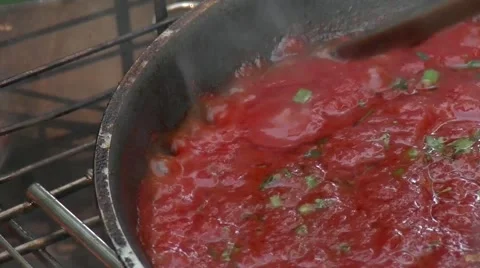 Tomato sauce cooking on an open fire. Close up. 動画素材 59794624