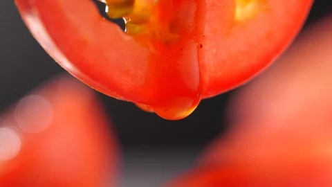 Tomato sauce dropping from a Tomato slice in slow motion Stock Footage 126953219