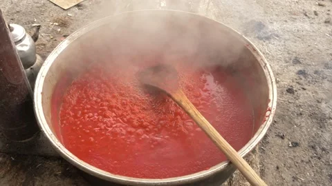 Tomato sauce made with traditional methods in Turkey. Natural over wood fire 4K Stock Footage 139918713
