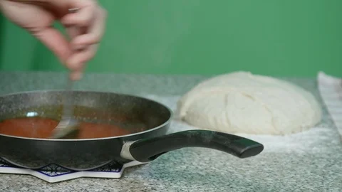 Tomato sauce in the pot for the preparation of typical products - green scree Stock Footage 126832802