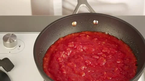 Tomato sauce simmering in a pan Stock Footage 24671910
