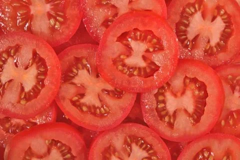 Tomato slices background Stock Photos