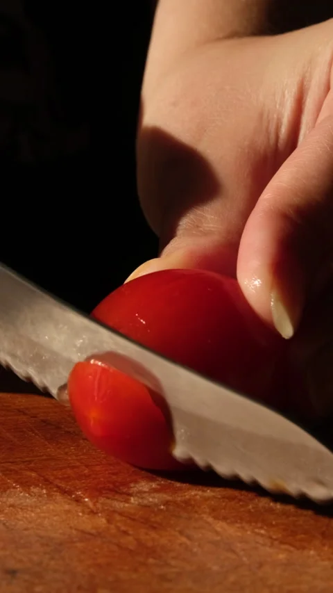 Tomato slicing at board close up vertical video Stock Footage 155079515