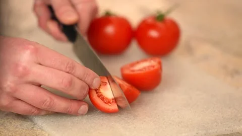 Tomato slicing close up on wooden surface Video stock 264523853